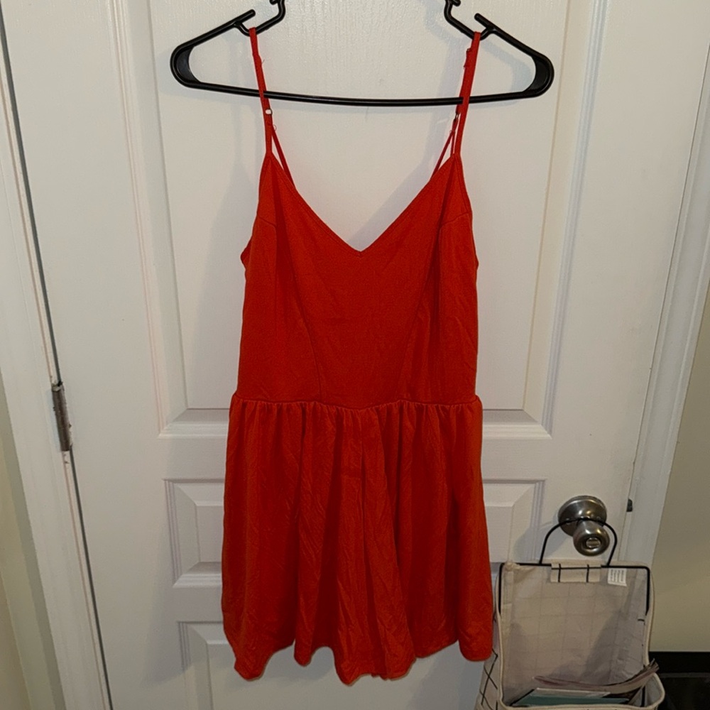 GB orange romper size M with crossed straps in the back